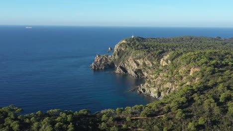 Lighthouse-on-Porquerolles-island-aerial-shot-forest-and-mediterranean-sea